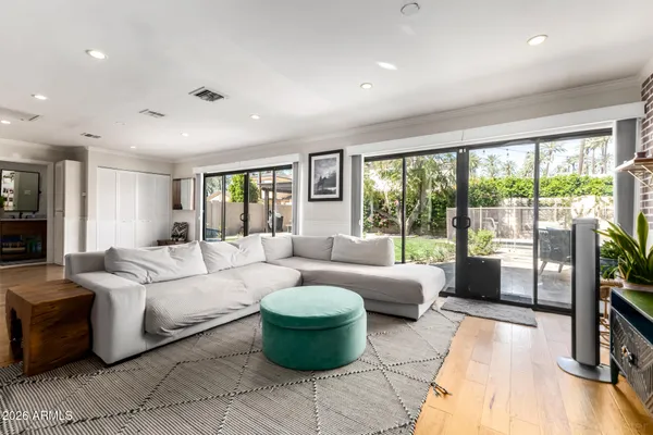 a living room with furniture and a large window