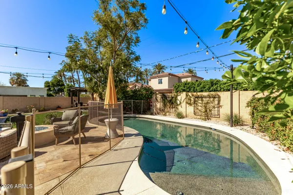 a view of a patio with swimming pool