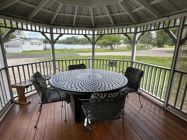 a view of a balcony with table and chairs