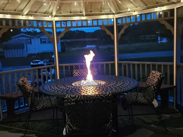 a view of a chairs and tables in patio