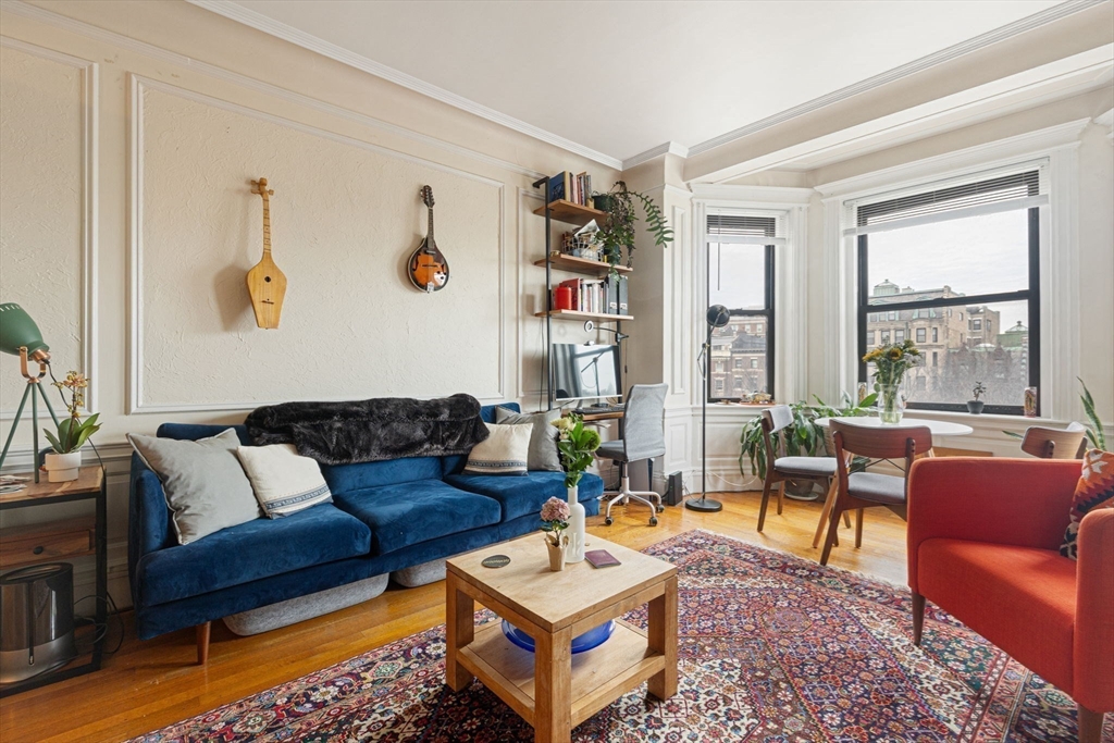 466 Commonwealth Avenue, Unit 502 Boston, MA 02215 - Photo 4 of 16 a living room with furniture and a window