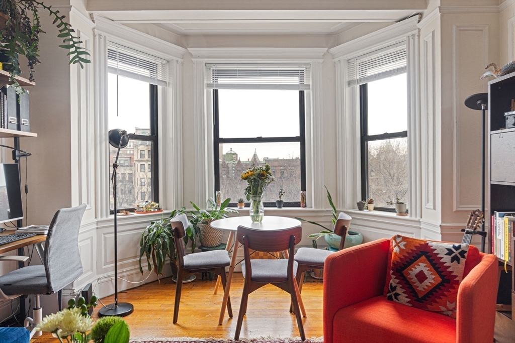 466 Commonwealth Avenue, Unit 502 Boston, MA 02215 - Photo 6 of 16 a living room with furniture and a large window