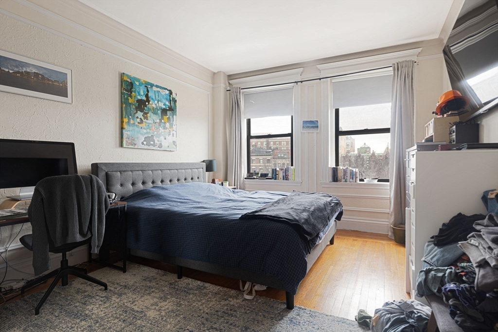 466 Commonwealth Avenue, Unit 502 Boston, MA 02215 - Photo 9 of 16 a spacious bedroom with a bed and wooden floor