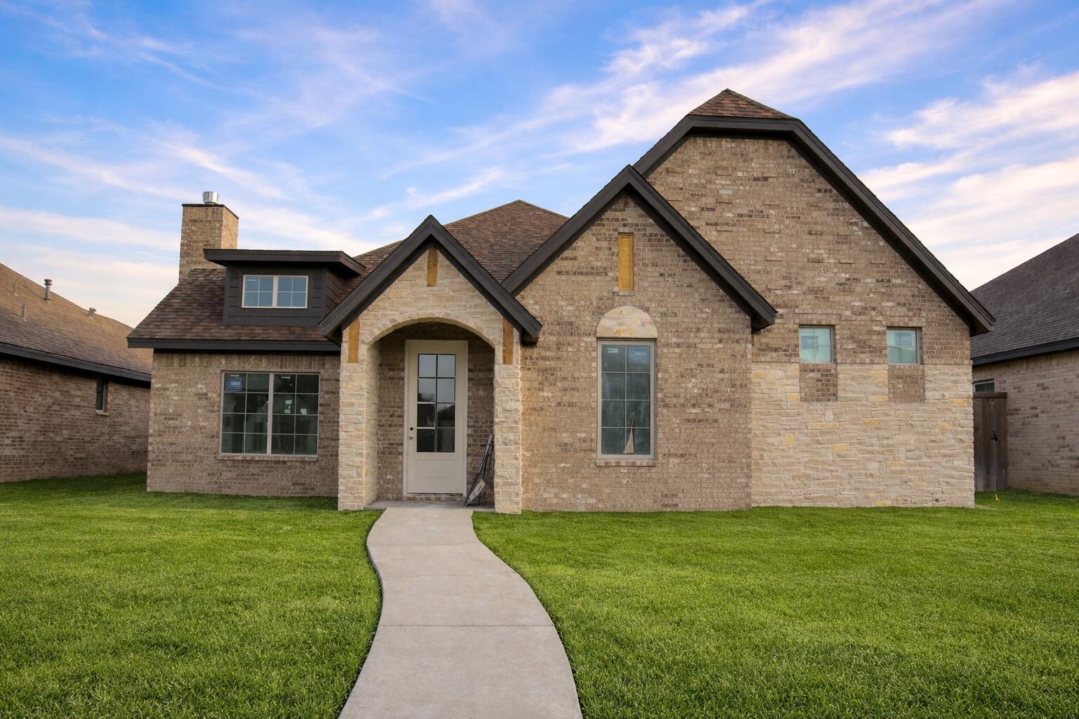 7806 53rd Street Lubbock, TX 79407 - Photo 14 of 14 a front view of a house with a yard