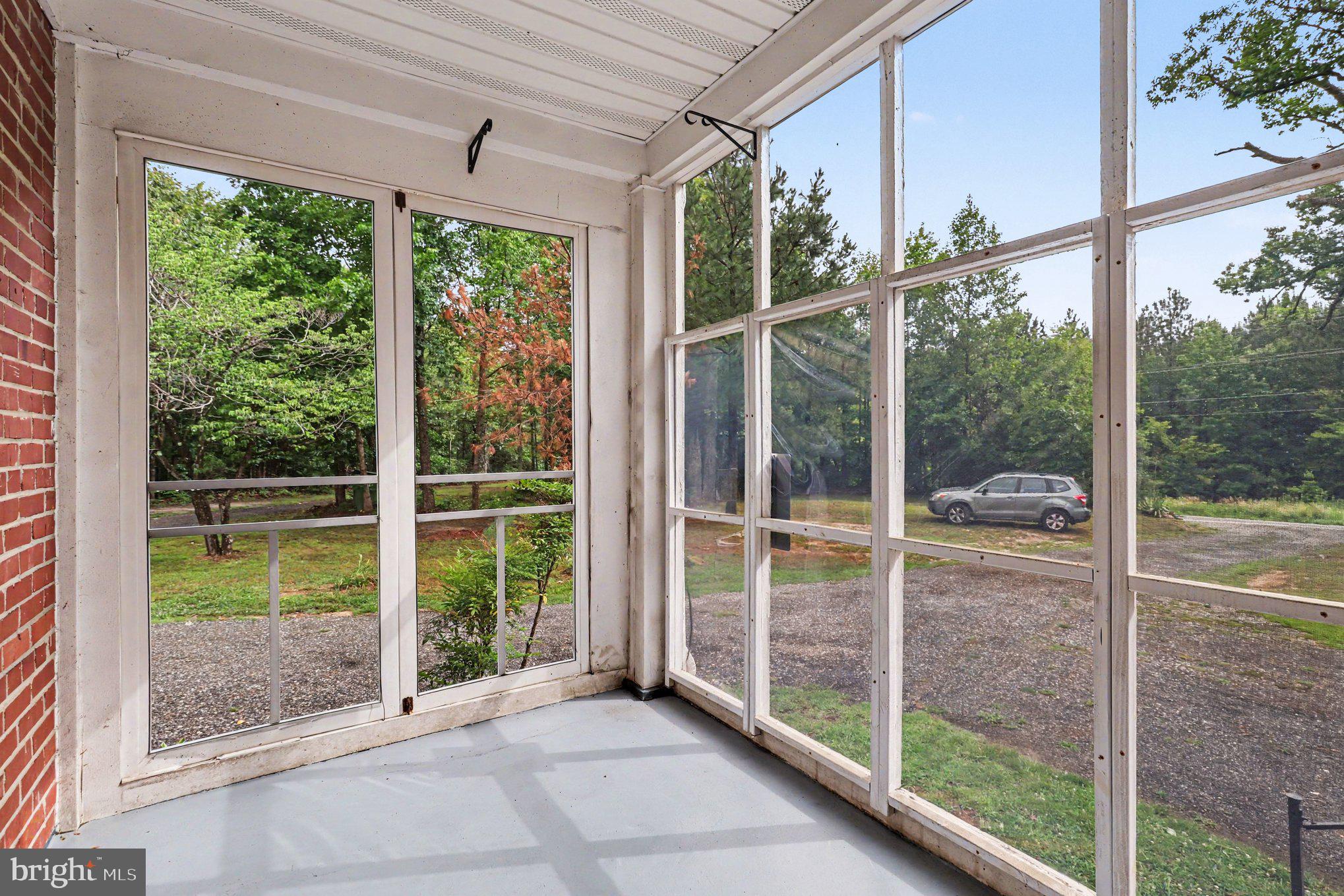 24294 Ruther Glen Road Ruther Glen, VA 22546 - Photo 4 of 28 Screened in porch in front yard