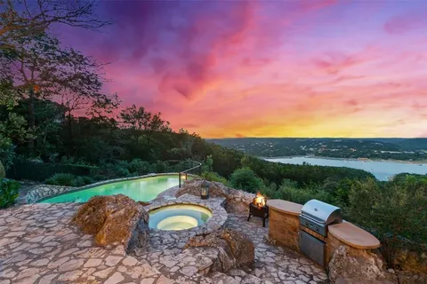 a view of a swimming pool with a yard