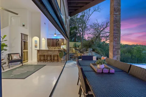 a view of a chairs and table in patio
