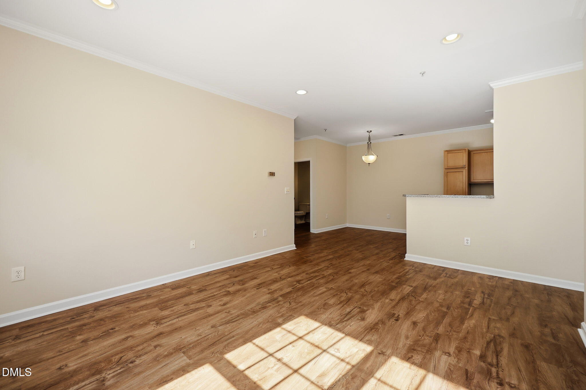 801 Moratuck Drive, Unit 202 Raleigh, NC 27604 - Photo 10 of 23 a view of a big room with wooden floor and a window