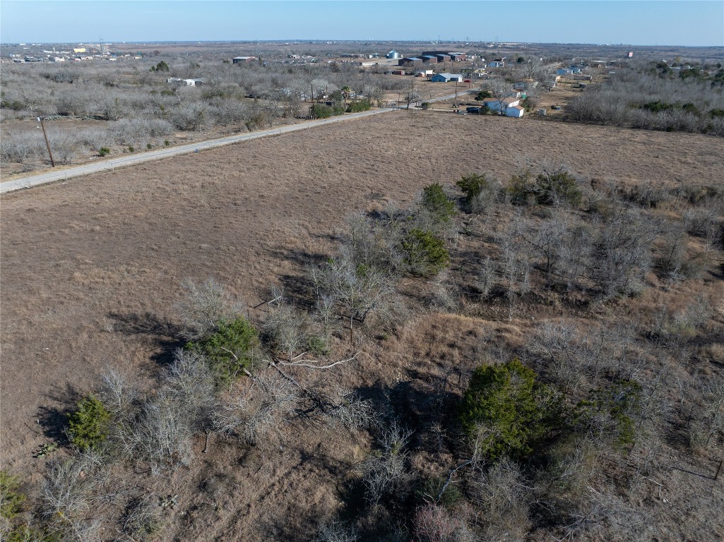 a view of a field with trees