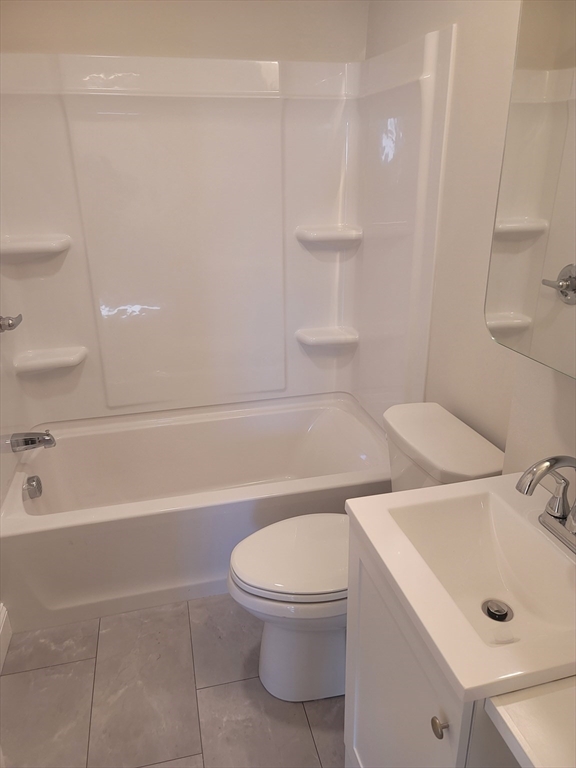 98 Uncatena Avenue, Unit L Worcester, MA 01606 - Photo 9 of 11 a bathroom with a toilet a sink and bathtub