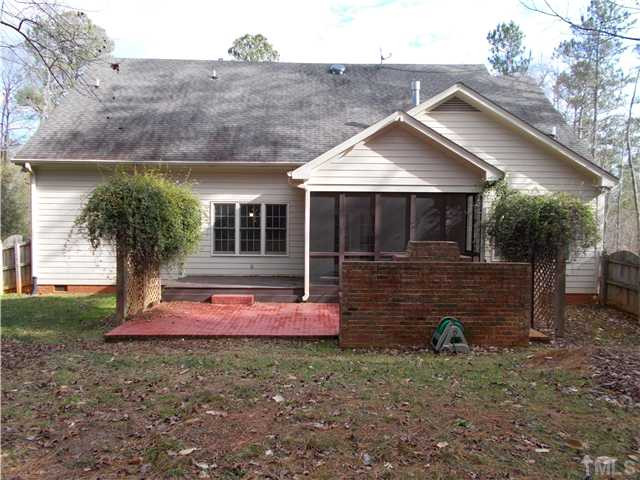 8417 Wycombe Ridge Way Wake Forest, NC 27587 - Photo 19 of 25 Rear of the home with screened porch, deck, and large grilling patio. Great for entertaining. Exterior Back