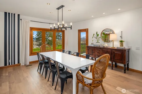 a view of a dining room with furniture window and outside view