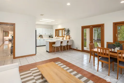 a living room with lots of furniture and wooden floor