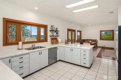 a kitchen with sink and window