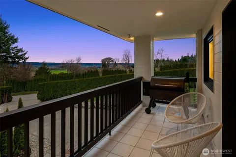 a view of balcony with wooden floor and outdoor seating