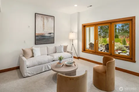 a living room with furniture and large window