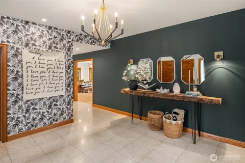 a view of hall way with furniture