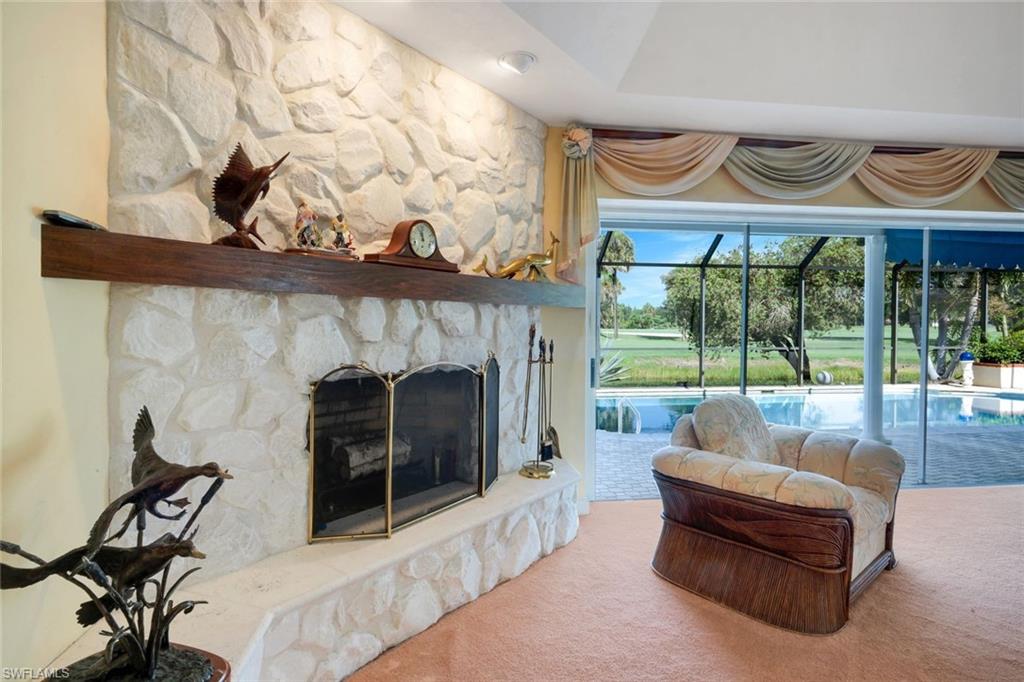 2227 Regal Way Naples, FL 34110 - Photo 11 of 34 Living Room Fireplace