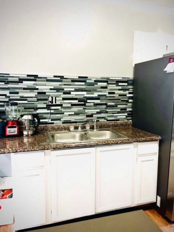 290 Pebblestone Road Dale, TX 78616 - Photo 6 of 12 a kitchen with granite countertop a sink and a stove