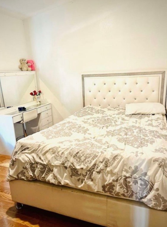 290 Pebblestone Road Dale, TX 78616 - Photo 8 of 12 a bedroom with a bed and wooden floor