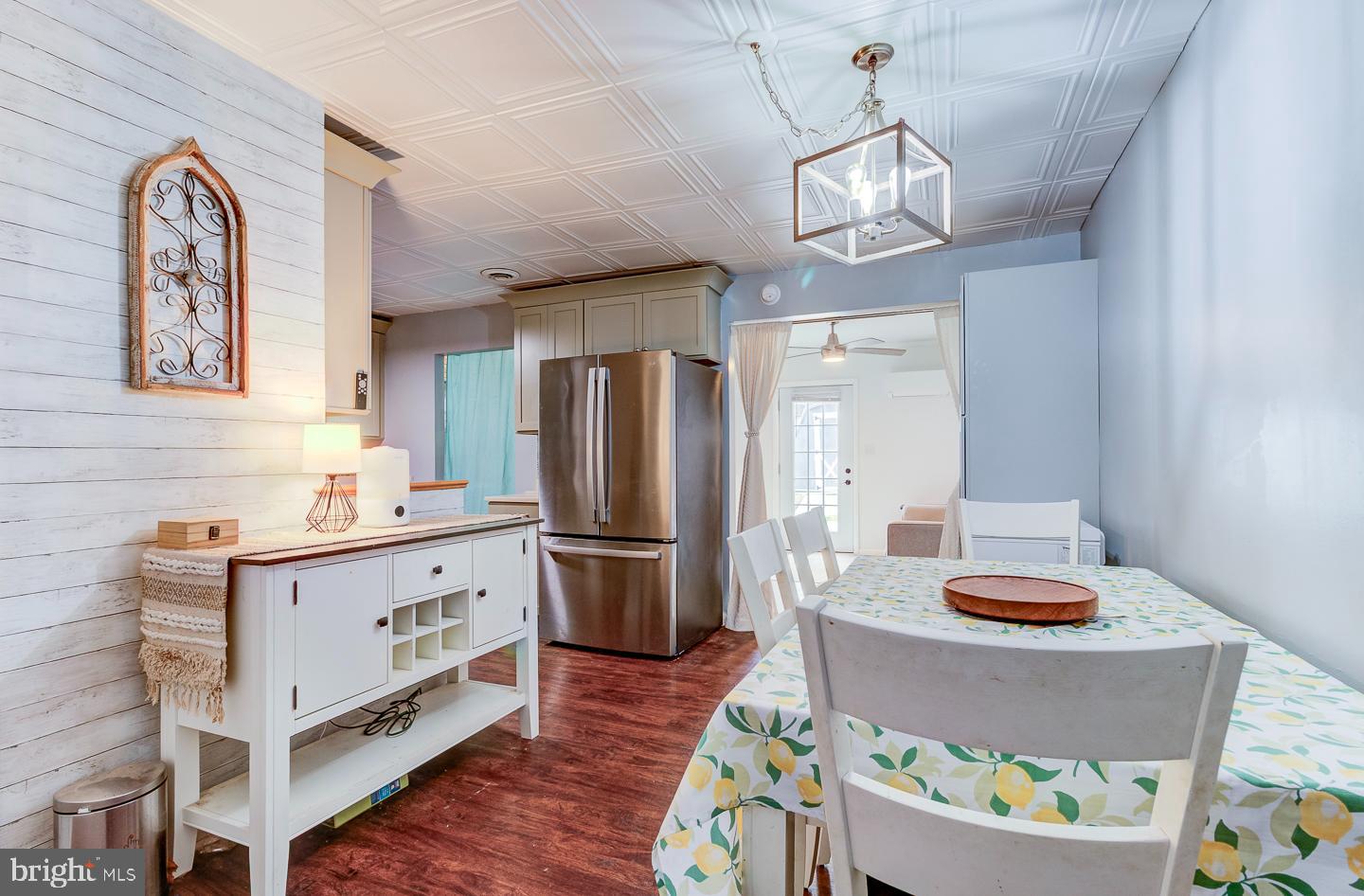 21 Louise Court Rising Sun, MD 21911 - Photo 6 of 25 a kitchen with stainless steel appliances granite countertop a stove refrigerator a dining table and chairs with wooden floor