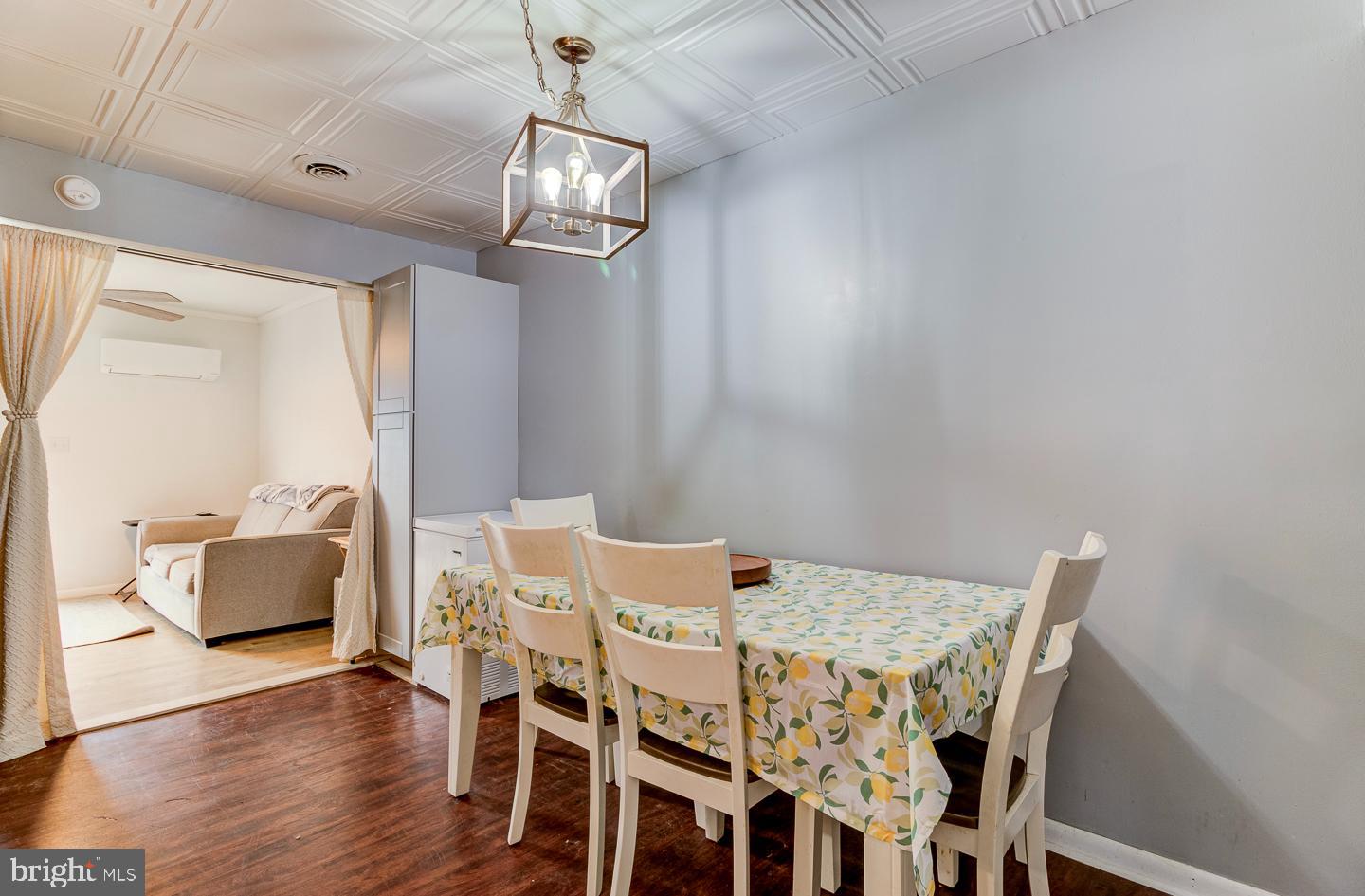 21 Louise Court Rising Sun, MD 21911 - Photo 7 of 25 a view of a dining room with furniture a chandelier and wooden floor