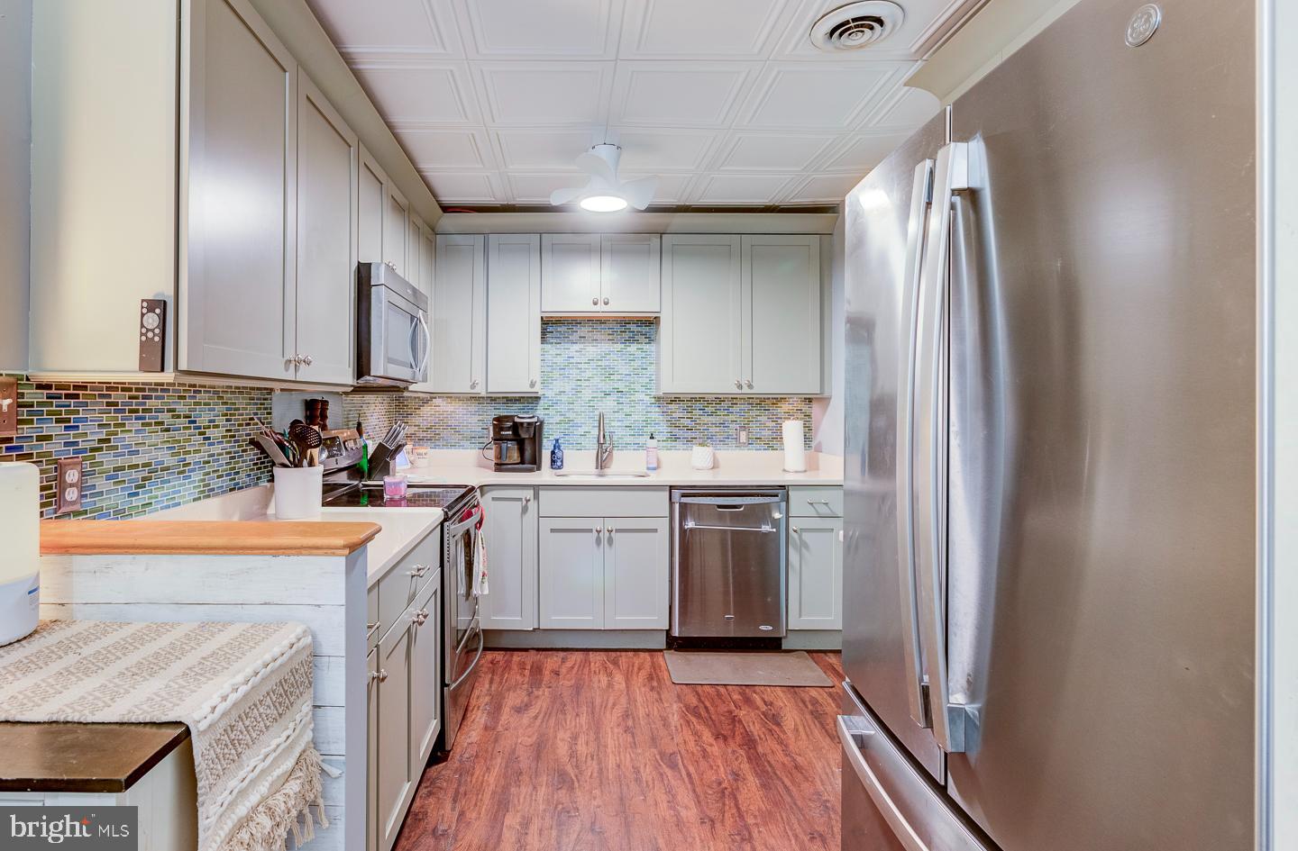 21 Louise Court Rising Sun, MD 21911 - Photo 8 of 25 a kitchen with stainless steel appliances granite countertop a refrigerator a sink dishwasher a stove top oven a sink and dishwasher