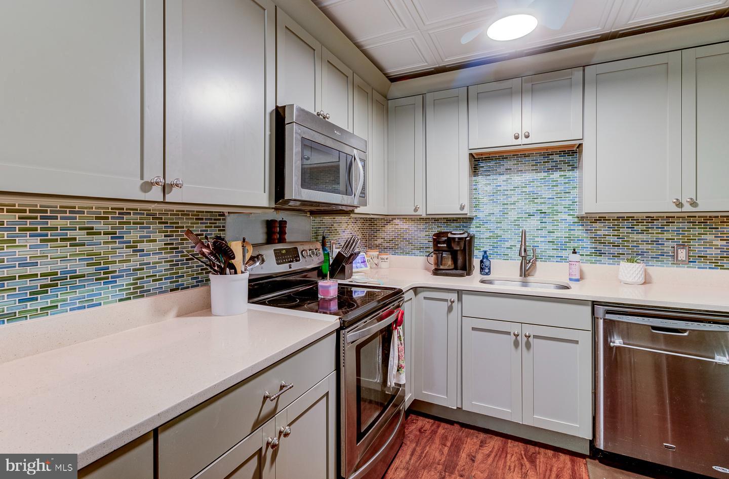21 Louise Court Rising Sun, MD 21911 - Photo 9 of 25 a kitchen with stainless steel appliances granite countertop a sink stove and cabinets