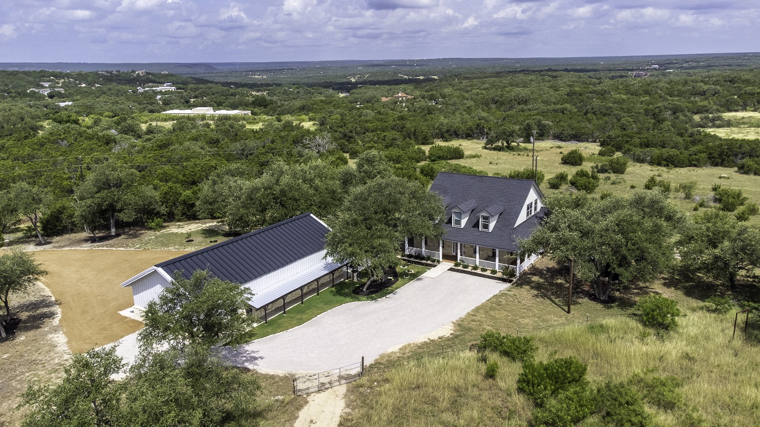 15020 Hero Way West Leander, TX 78641 - Photo 1 of 38 an aerial view of residential houses with outdoor space and trees all around