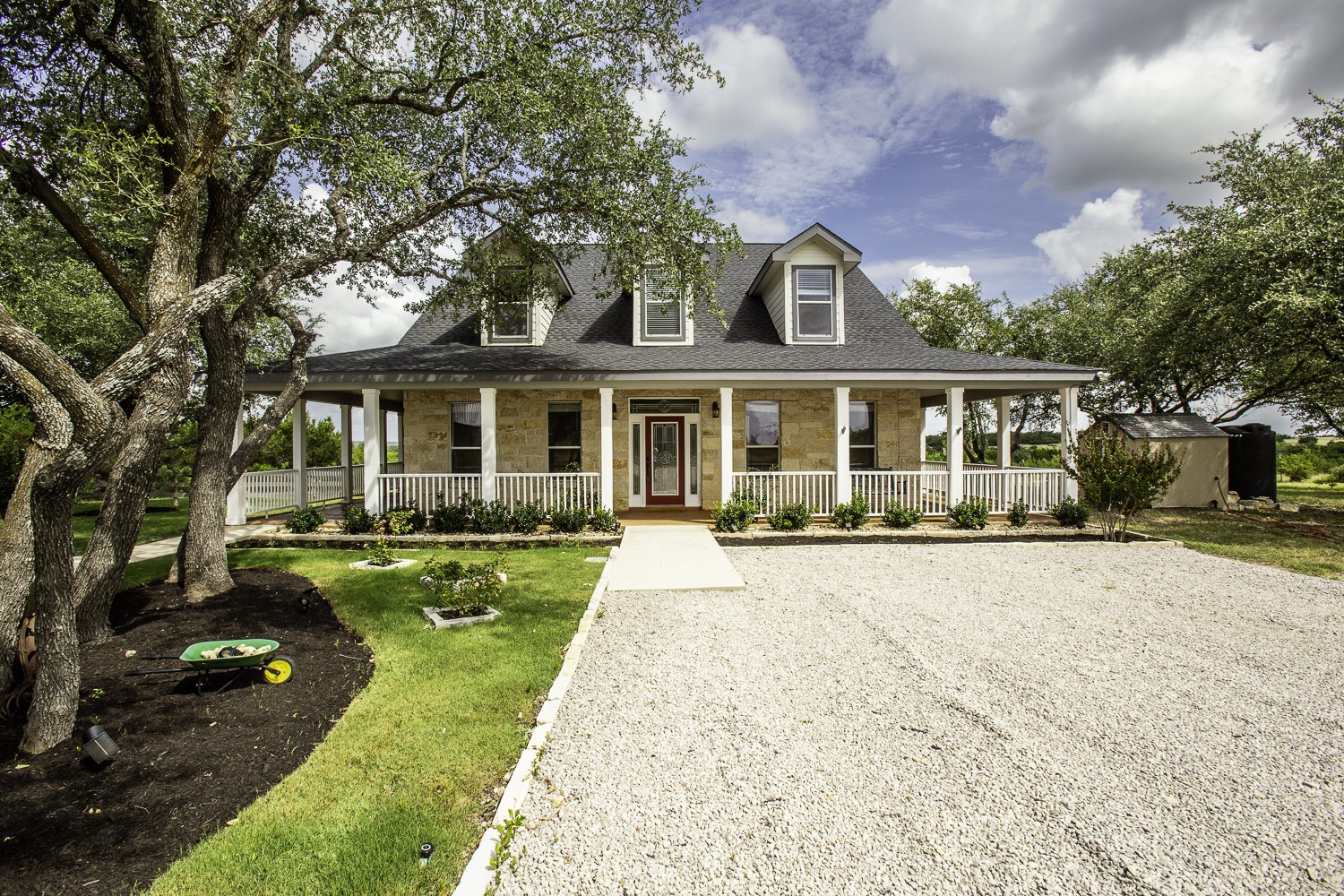 front view of a house with a yard