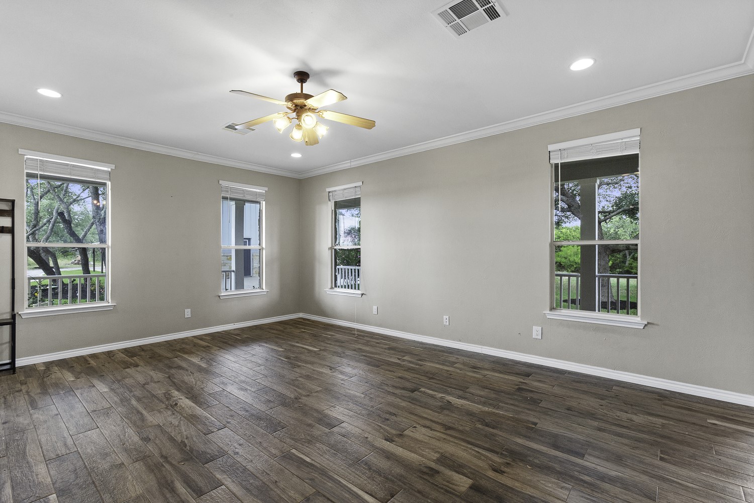 15020 Hero Way West Leander, TX 78641 - Photo 19 of 38 a view of an empty room with wooden floor and a window
