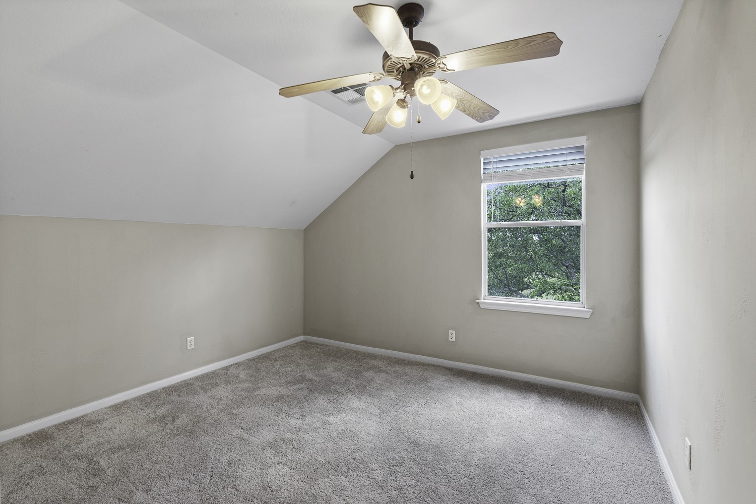 15020 Hero Way West Leander, TX 78641 - Photo 27 of 38 an empty room with a chandelier fan and windows