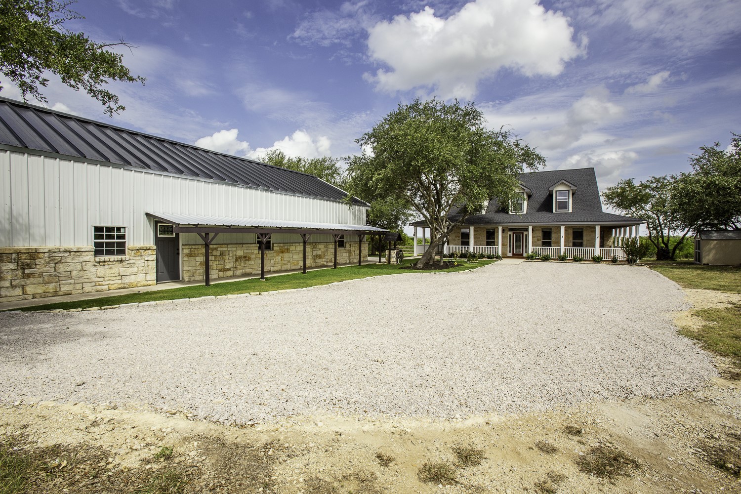 15020 Hero Way West Leander, TX 78641 - Photo 5 of 38 a front view of a building with a garden and trees