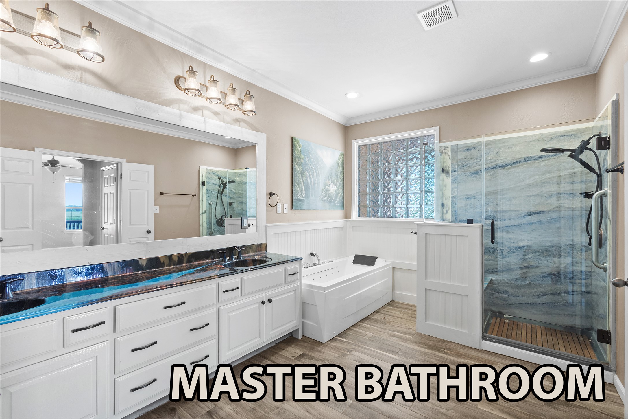 15020 Hero Way West Leander, TX 78641 - Photo 10 of 38 a spacious bathroom with a granite countertop sink and a mirror