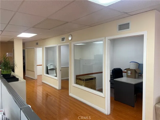 a kitchen with a refrigerator and sink