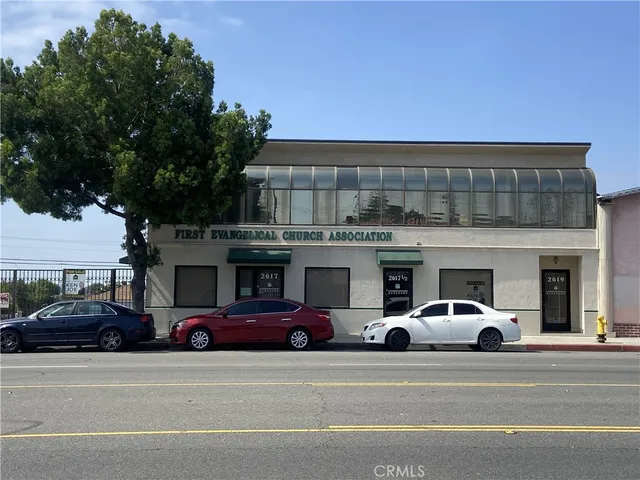 a view of a cars parked in front of a building