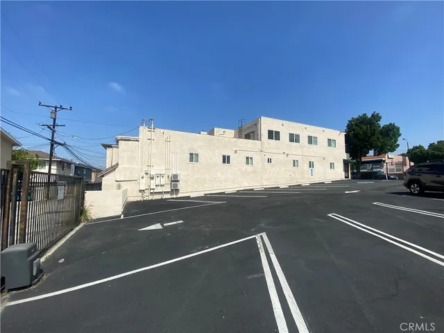 a view of a city street with tall buildings