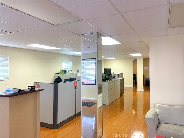 a view of kitchen with furniture and wooden floor