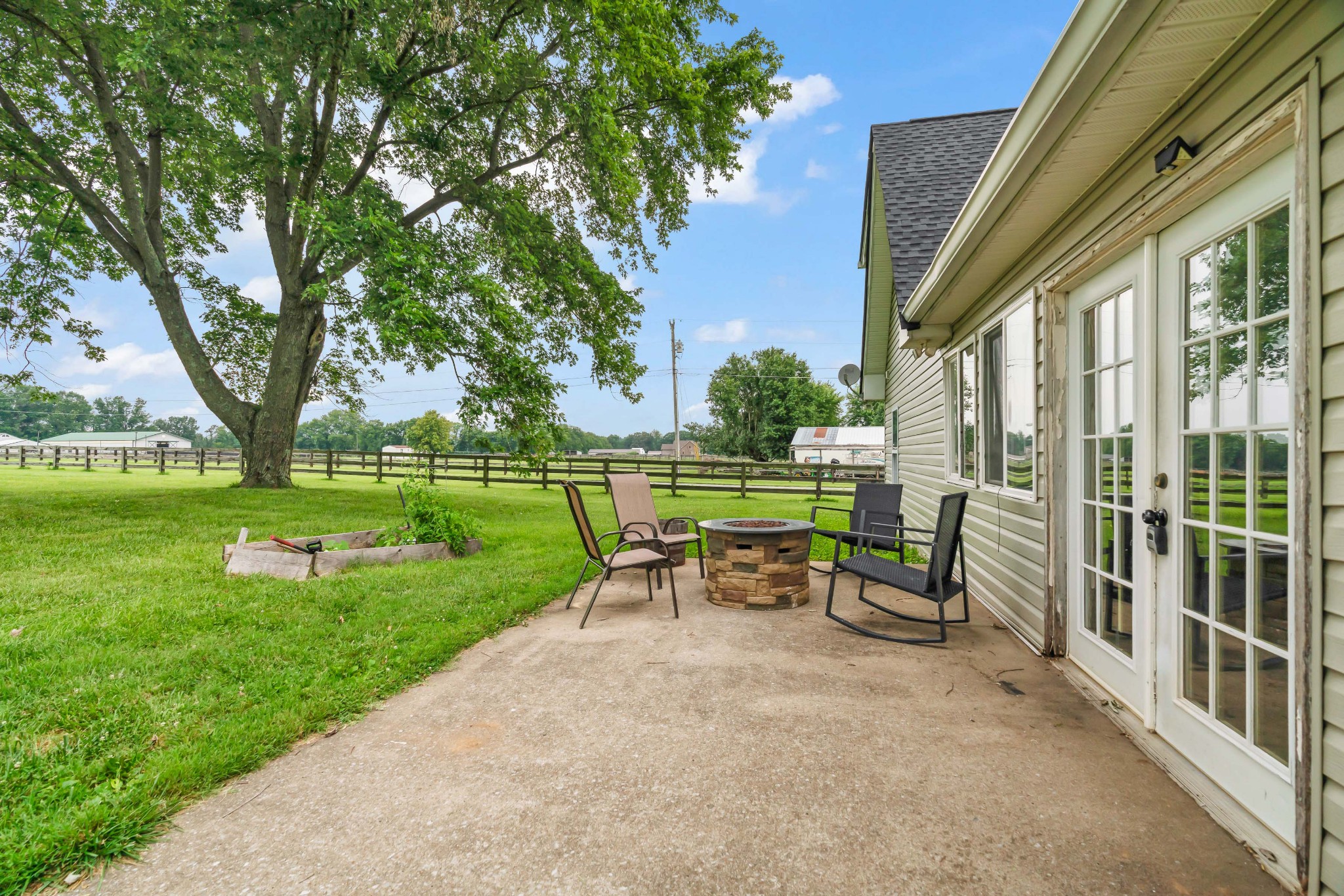 443 Halltown Road Portland, TN 37148 - Photo 11 of 49 a view of a house with a backyard porch and sitting area
