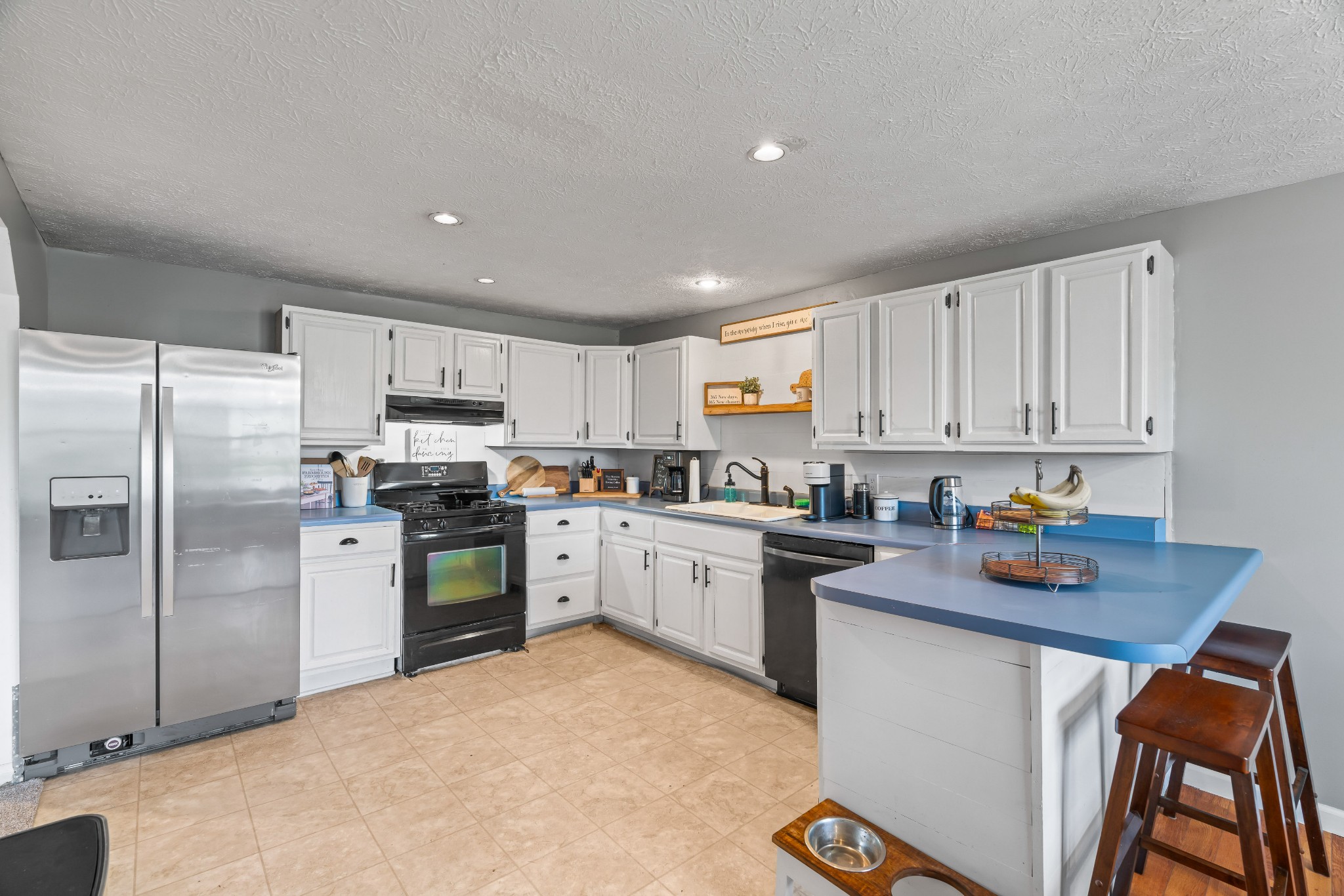 443 Halltown Road Portland, TN 37148 - Photo 21 of 49 a kitchen with stainless steel appliances granite countertop a refrigerator sink and stove
