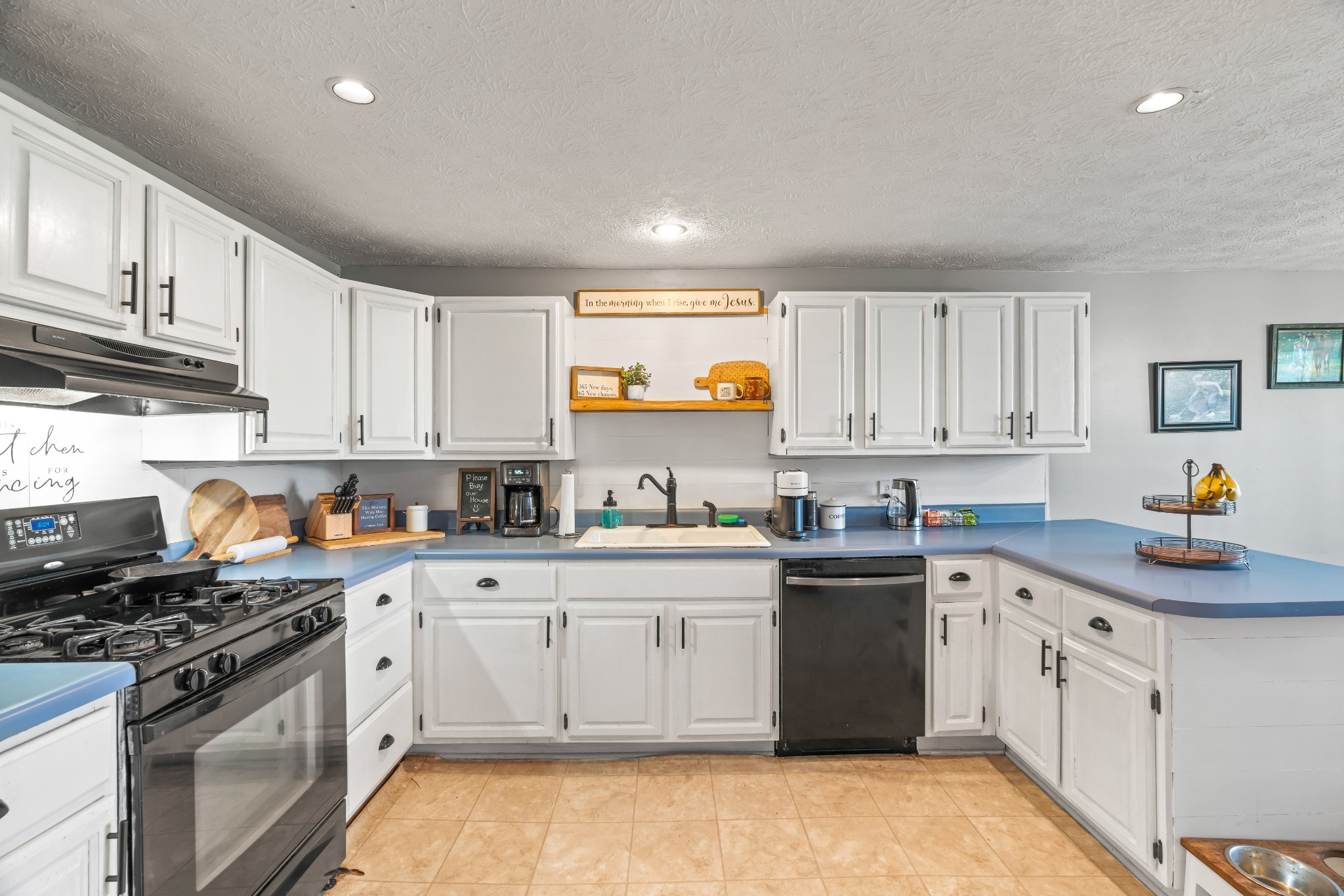 443 Halltown Road Portland, TN 37148 - Photo 24 of 49 a kitchen with granite countertop a sink a stove a refrigerator and cabinets