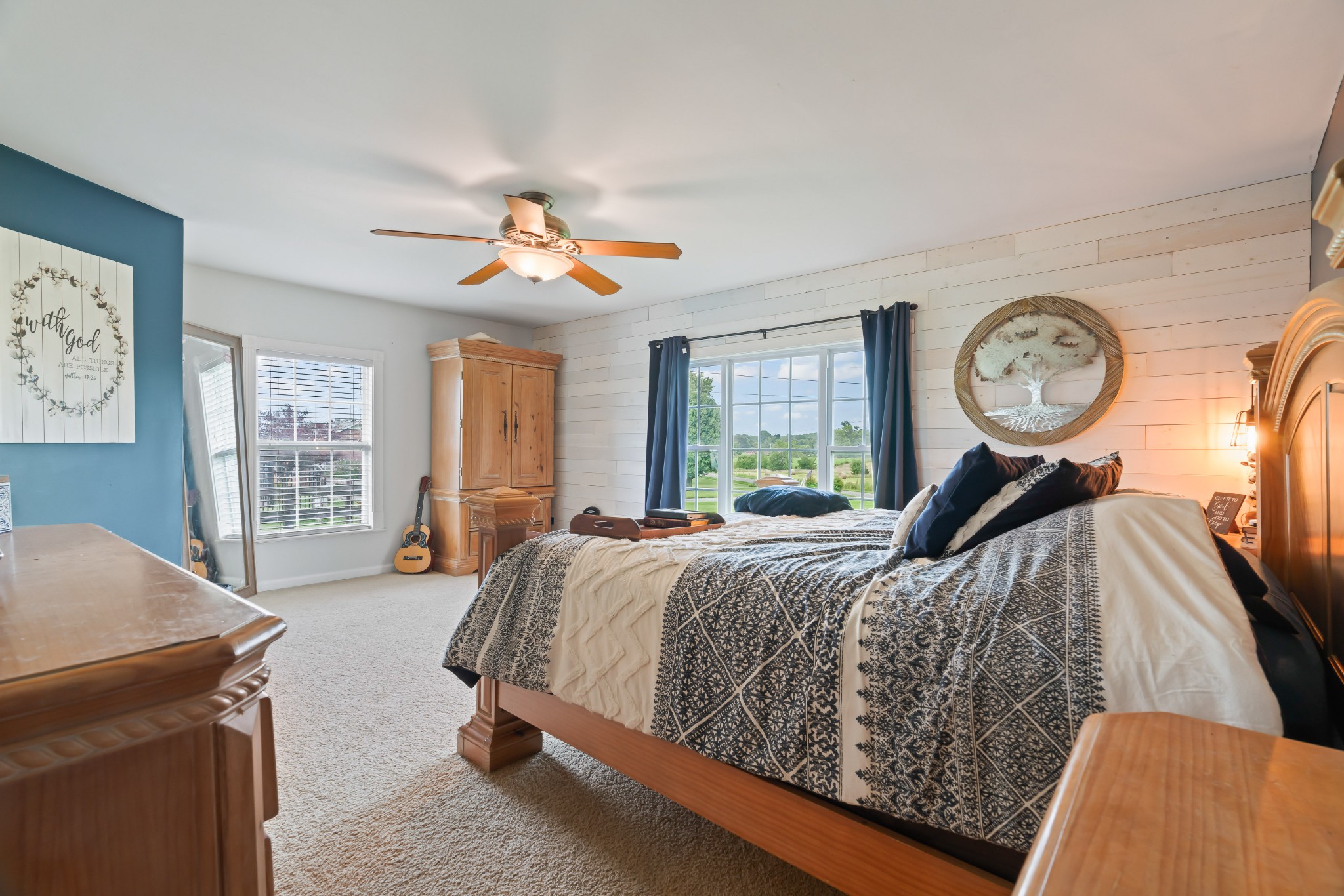 443 Halltown Road Portland, TN 37148 - Photo 36 of 49 a bed room with a bed and a chandelier