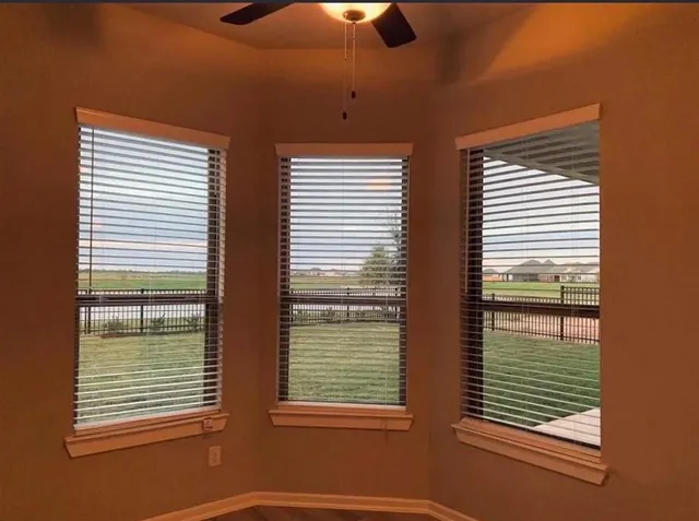 a view of an empty room and window