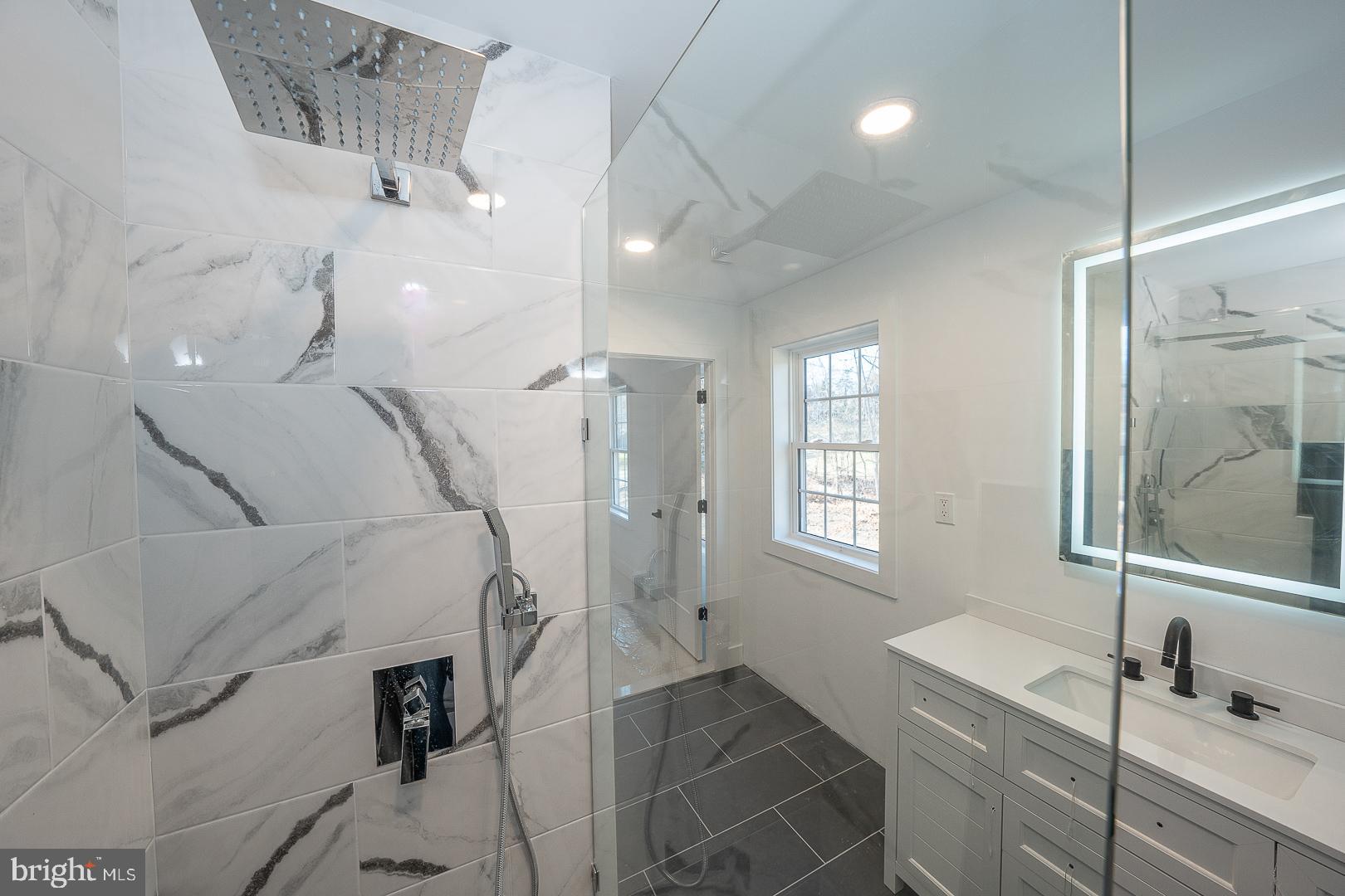 2627 County Line Road Chalfont, PA 18914 - Photo 24 of 37 a bathroom with a sink and a mirror