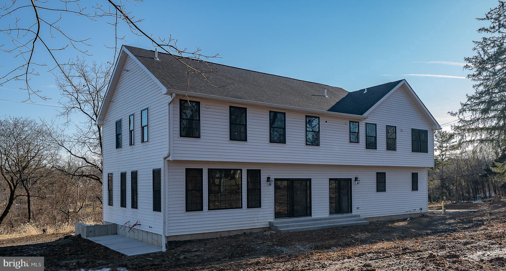 2627 County Line Road Chalfont, PA 18914 - Photo 36 of 37 a front view of a house with a garden