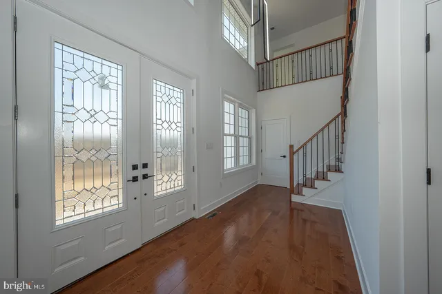 a view of an entryway with wooden floor