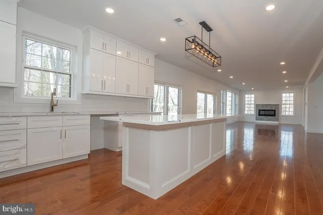 a kitchen with stainless steel appliances a refrigerator sink and cabinets