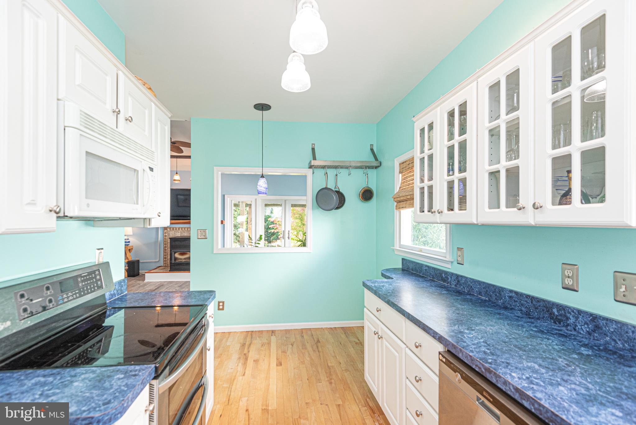 263 Oyster Shell Cove Bethany Beach, DE 19930 - Photo 13 of 50 a kitchen that has a lot of cabinets in it