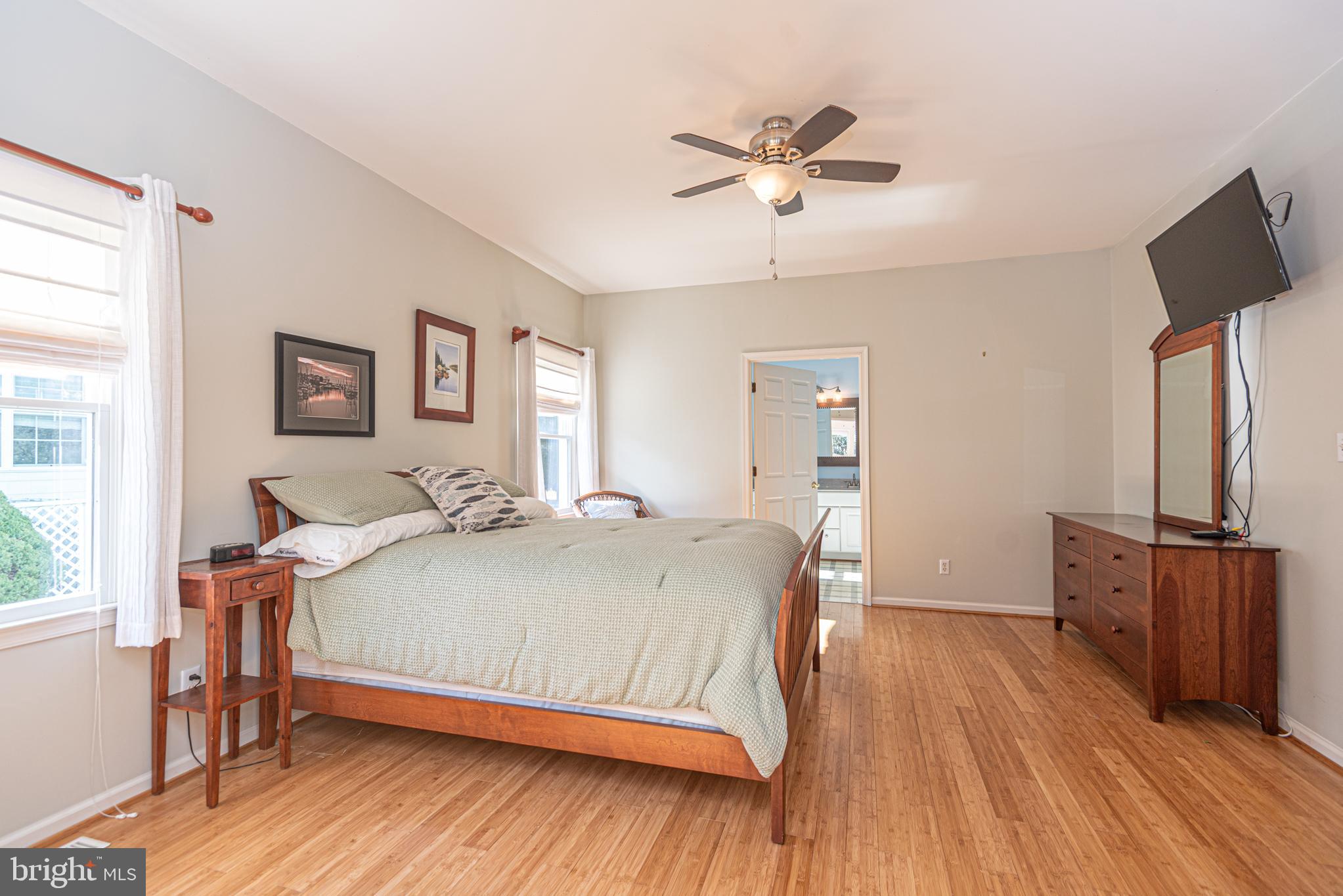 263 Oyster Shell Cove Bethany Beach, DE 19930 - Photo 18 of 50 a bedroom with a bed and wooden floor