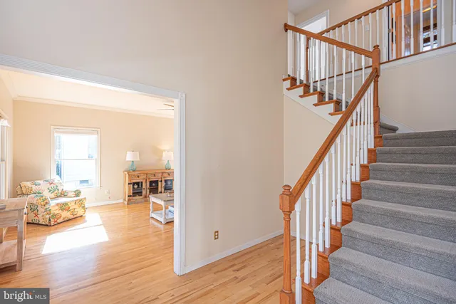 a view of entryway and wooden floor